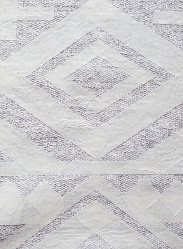 Aloita teippaaminen maton keskikohdasta tai päädystä.